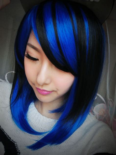 dark hair blue streaks|black person with blue hair.